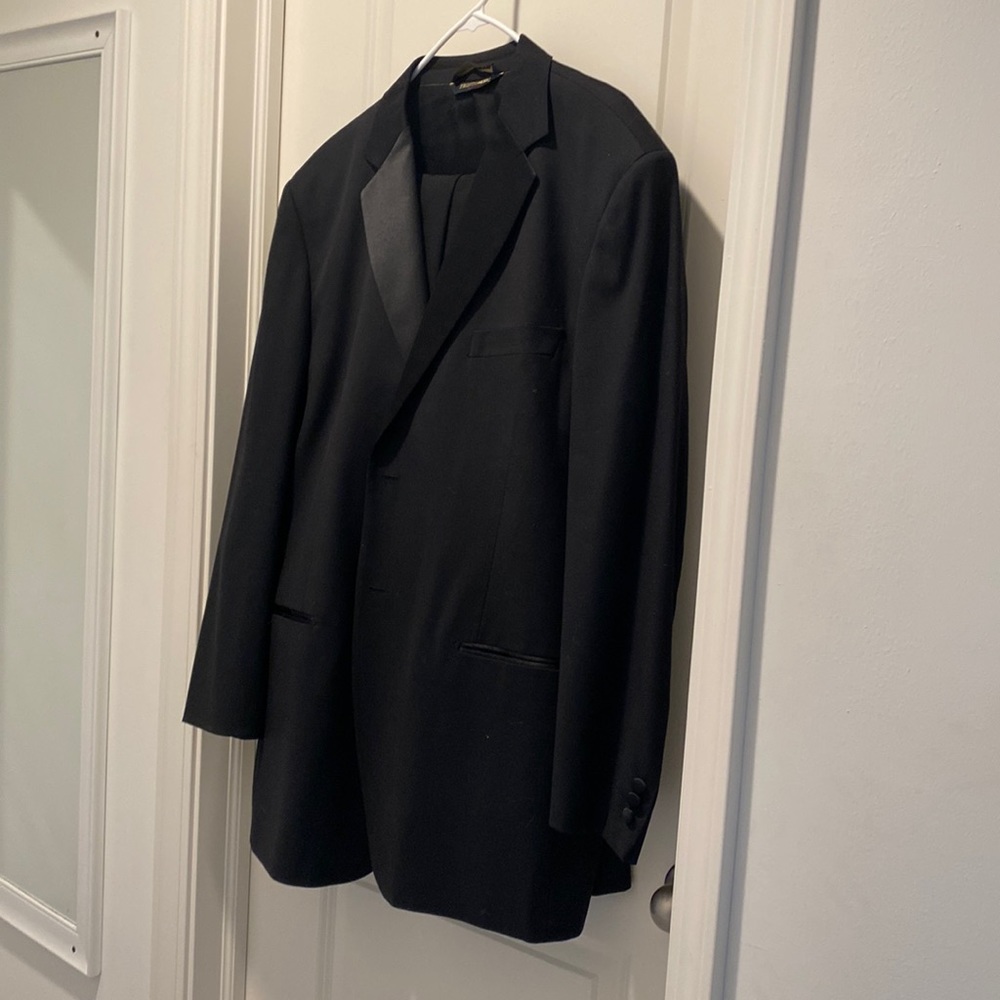 Men’s suit. Both Jacket and dress pants. Black. Worn once.